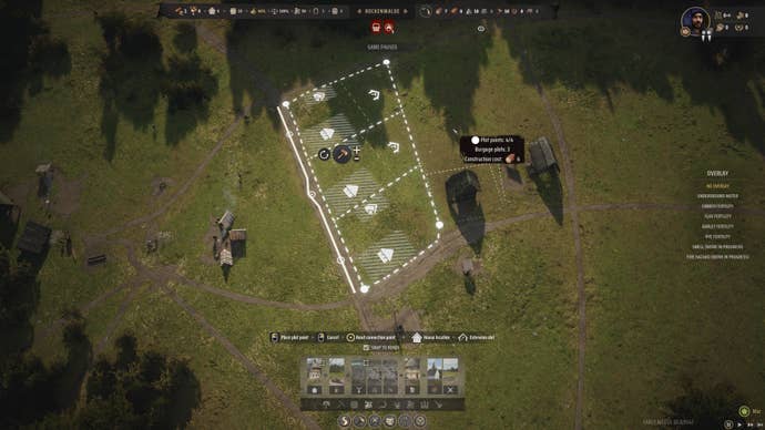 The player places down a section of Burgage Plots in Manor Lords.