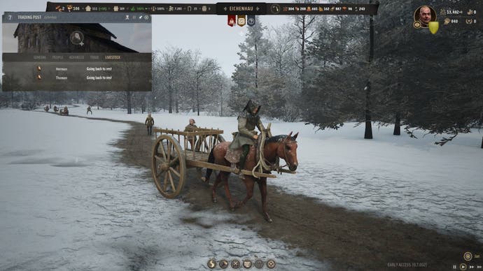 A man rides a horse and cart through the snow in Manor Lords
