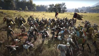 A shot from the Manor Lords trailer showing dozens of soldiers skirmishing on a sunlit field.