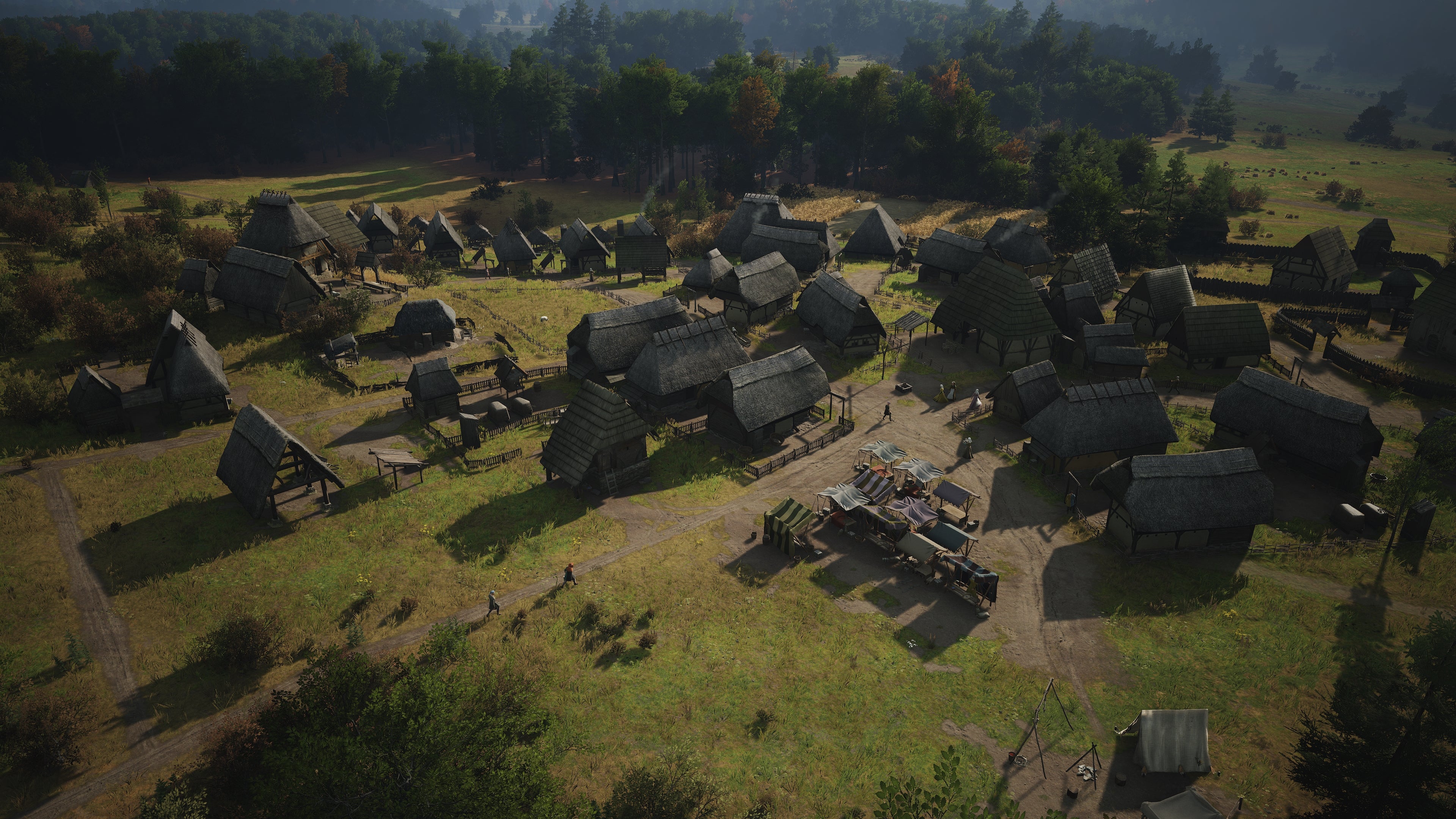 A bird&rsquo;s-eye view of a medium-sized village in Manor Lords.