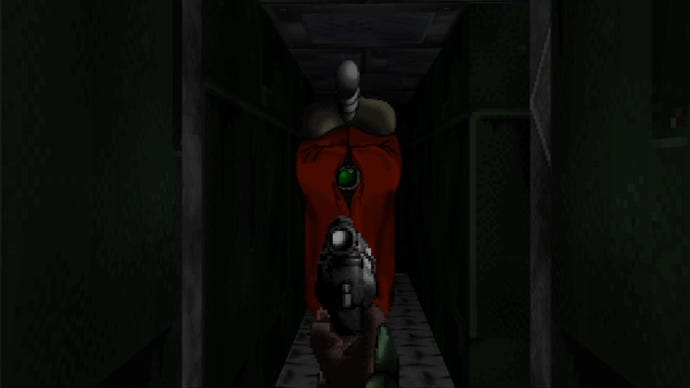 The player in Marathon (1994) aims their pistol at a Compiler drifting down a darkened corridor towards them.