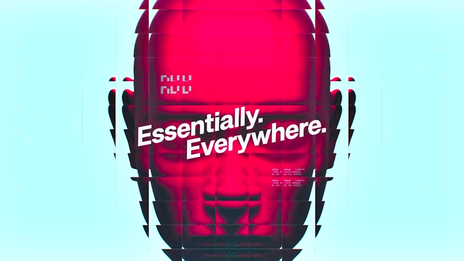 A close-up of a pixelated red face of Gaius, the AI spokesperson for the faction NuCaloric in Marathon. Imprinted over Gaius's eyes are the words "Essentially. Everywhere."