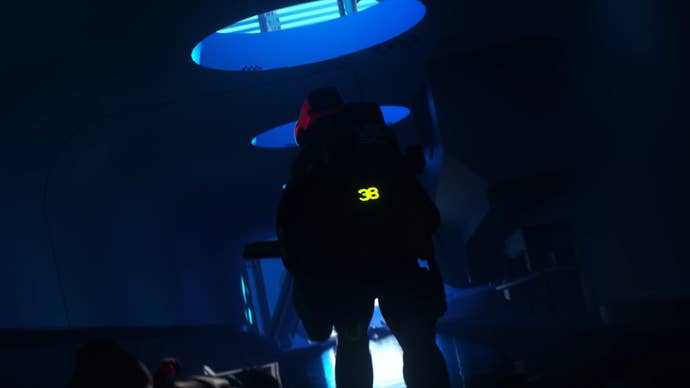 A runner sprints down a dark corridor in the Marathon trailer, with a green glowing timer on their back counting down.