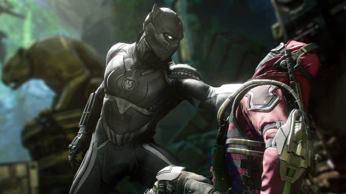 Black Panther is holding an enemy NPC in his hand in some kind of temple-like area in Marvel’s Avengers.