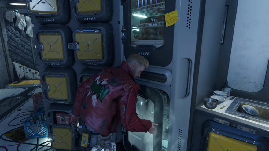 Peter Quill closes the fridge door in Marvel’s Guardians Of The Galaxy.