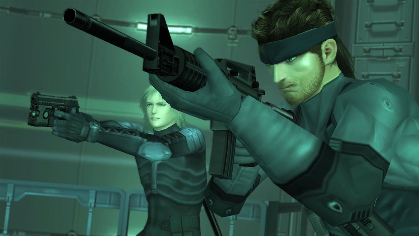 Solid Snake holds a rifle up in an iconically grey/green screenshot from Metal Gear Solid. - 1