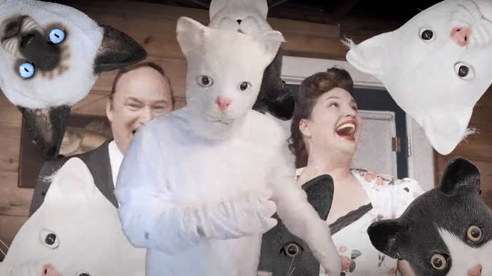 Shot from Mewgenic’s live-action trailer showing a delighted couple surrounding by people in slightly terrifying cat outfits.