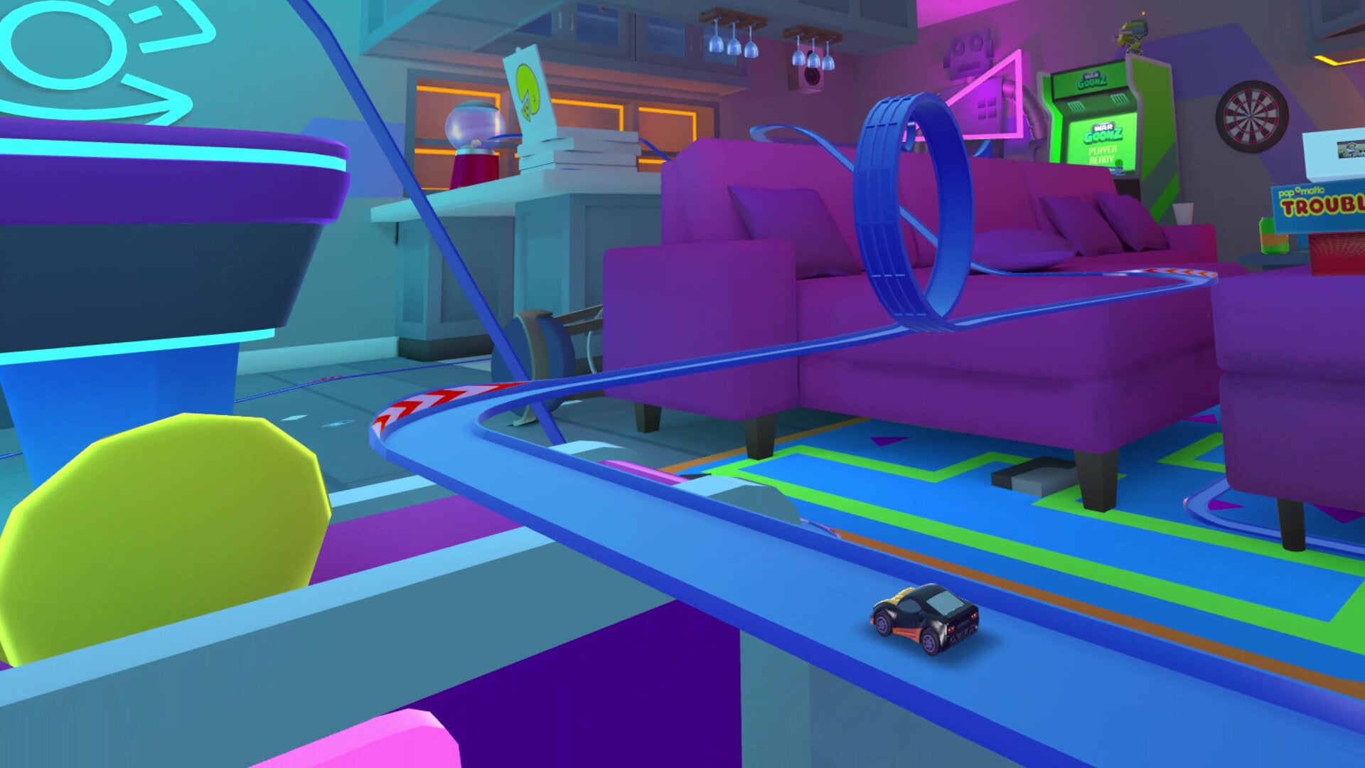 A racing track with a loop-the-loop runs through a living room in Micro Machines: Mini Challenge Mayhem - 3
