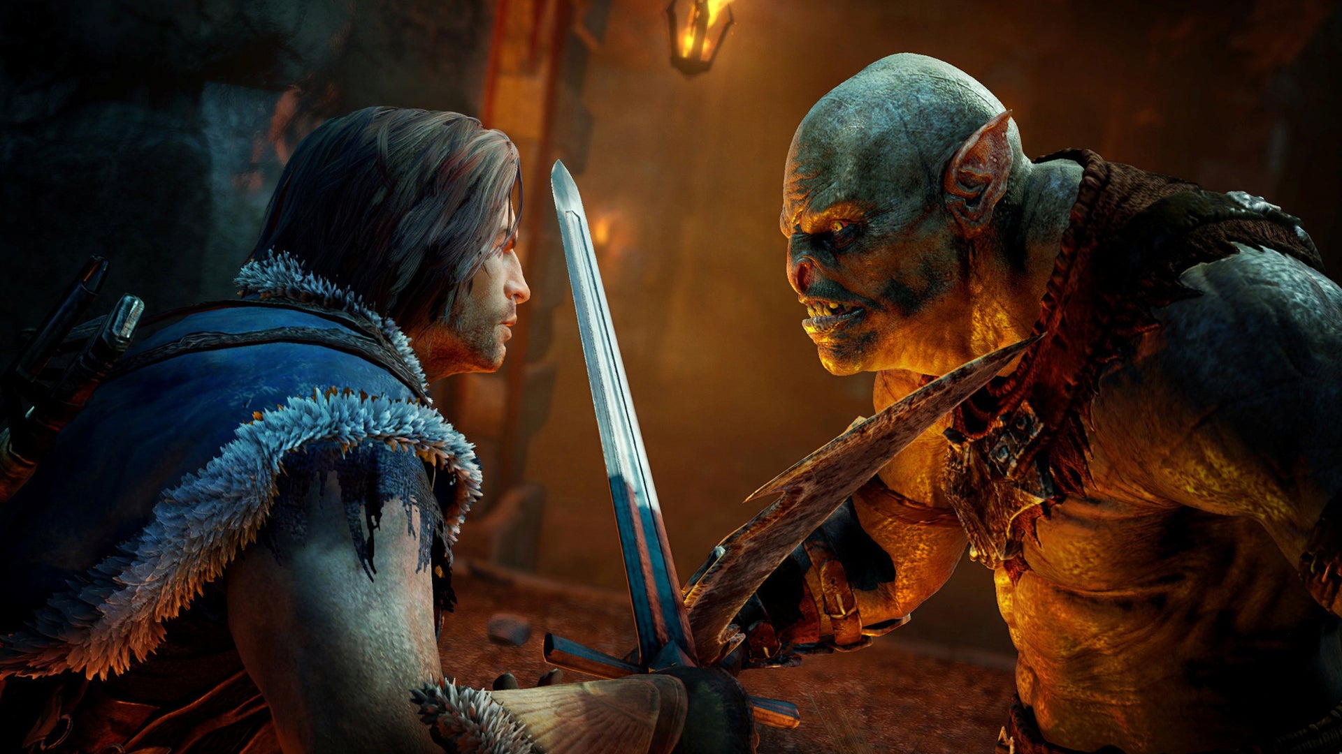 Talion is clashing blades with an Uruk, both of them staring at each other intently in Middle-earth: Shadow of Mordor. - 1