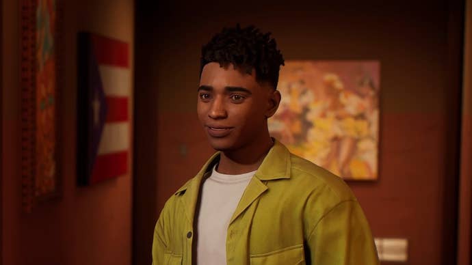 An shot of Miles Morales in his home in Harlem with a Puerto Rican flag behind him.