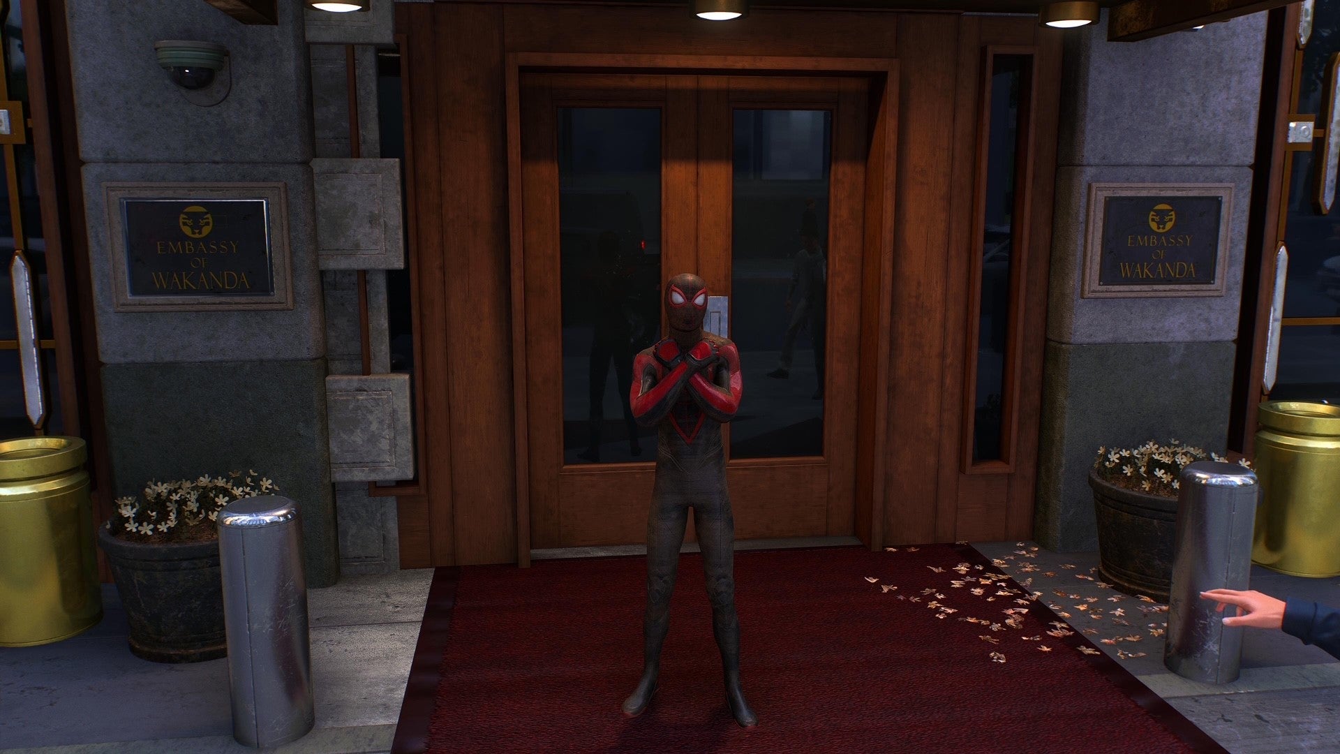 Miles performs the Wakanda Forever salute in Spider-Man 2