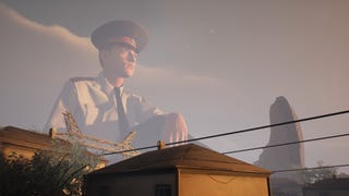A giant policeman looms over a town in a Militsioner screenshot.