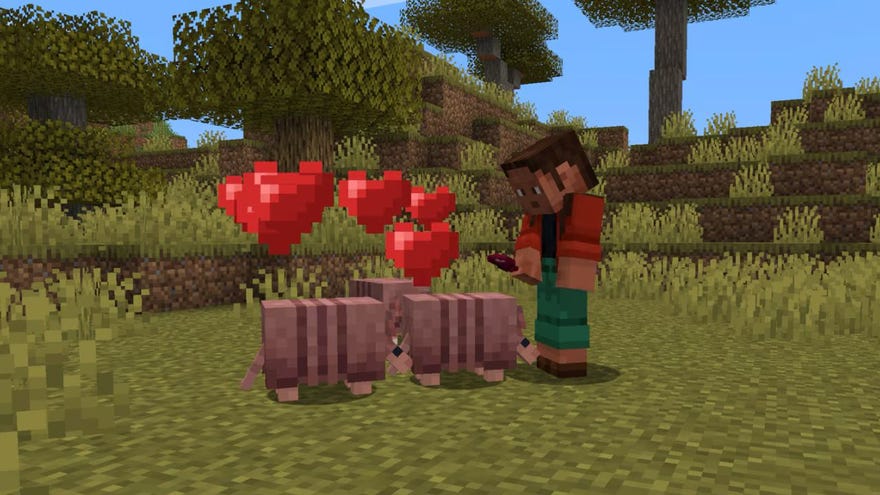 A player makes friends with three armadillos in Minecraft