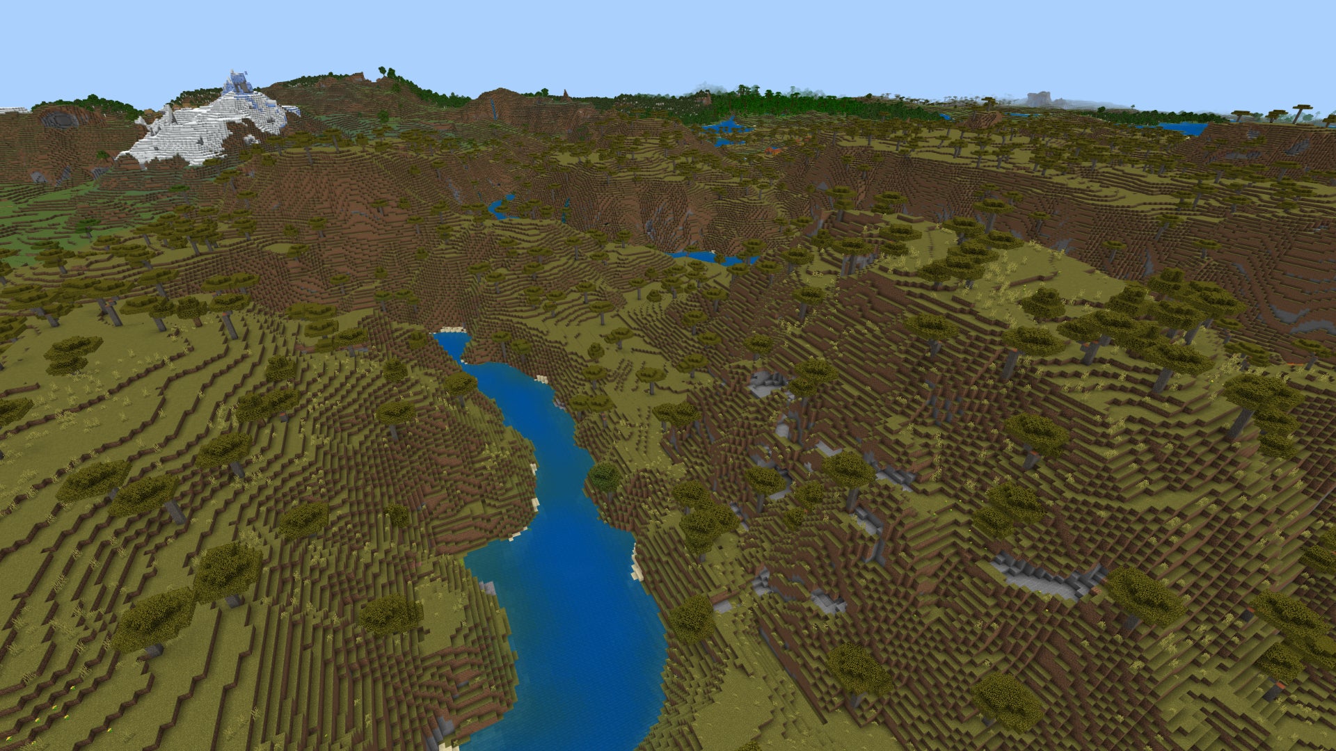 Screenshot of a Minecraft Bedrock landscape of savanna hills and rivers. - 15