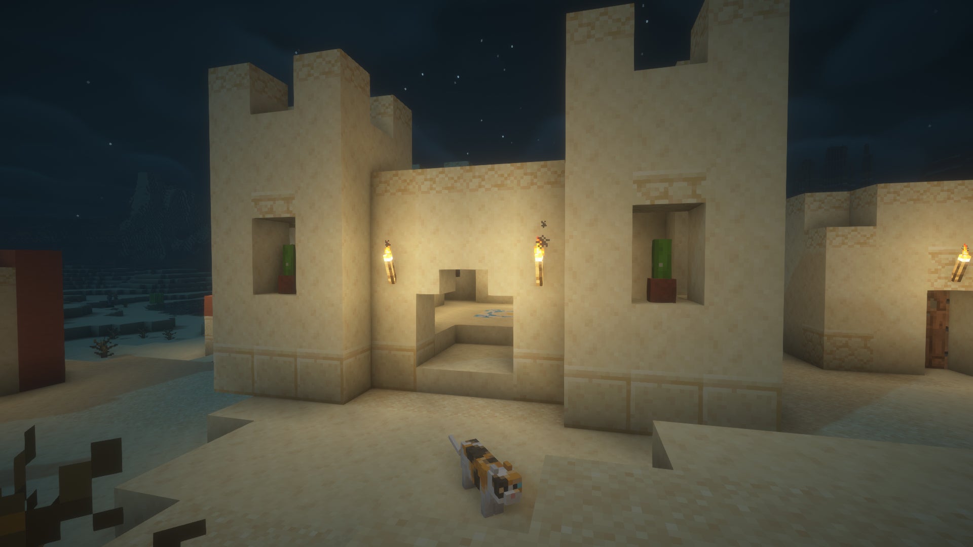 Screenshot of a desert village at night in Minecraft. - 5