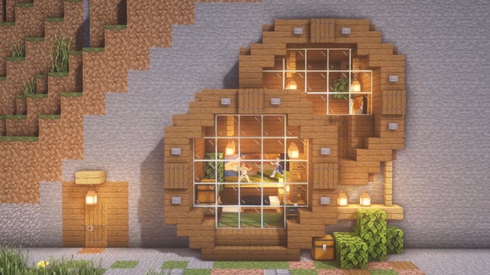 A house in Minecraft built into the side of a mountain, built by YouTuber "JUNS MAB Architecture Tutorial".