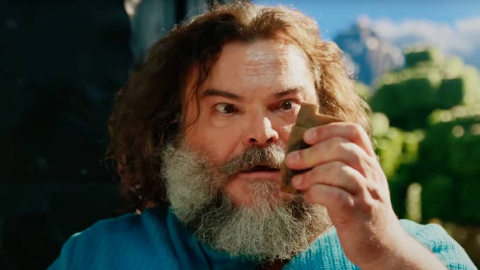 Jack Black as Steve in A Minecraft Movie looking at some FLINT AND STEEL.