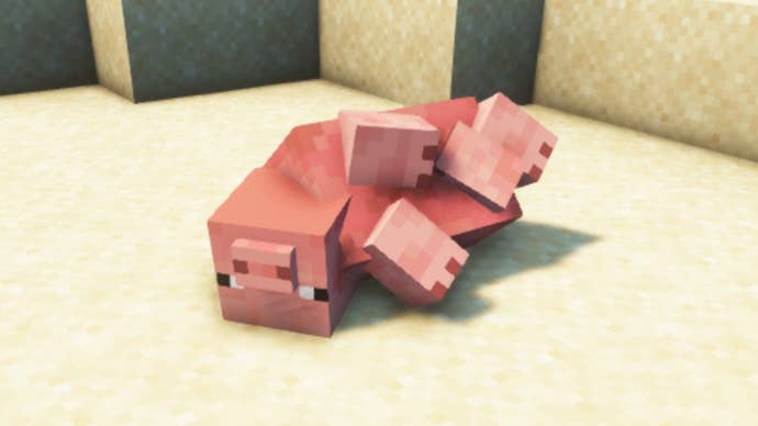 A Minecraft pig in a desert, upside down with the ragdoll effects from the Physics Mod enabled.