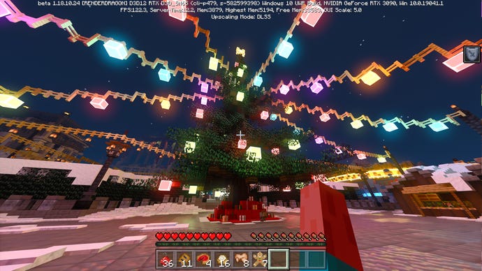 A giant Christmas tree, complete with lights and presents, in Nvidia’s Minecraft RTX Winter World map.