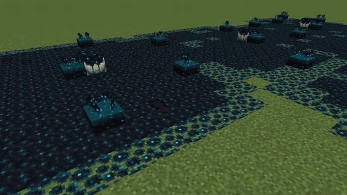 A growth of Sculk Blocks across a flat grassland world in Minecraft.