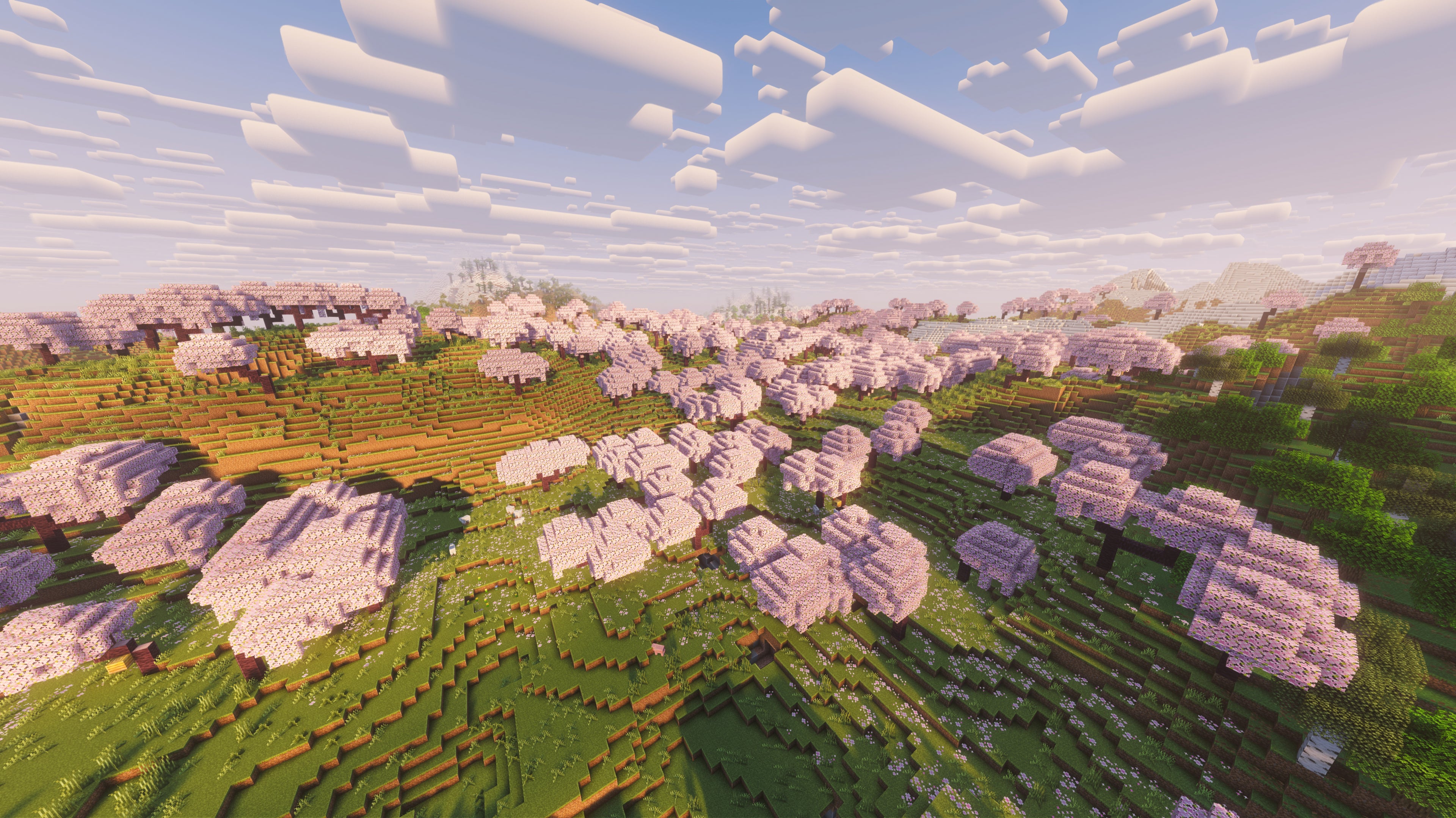 A landscape screenshot of a Minecraft seed, showing a large Cherry Grove built across several hills. - 7