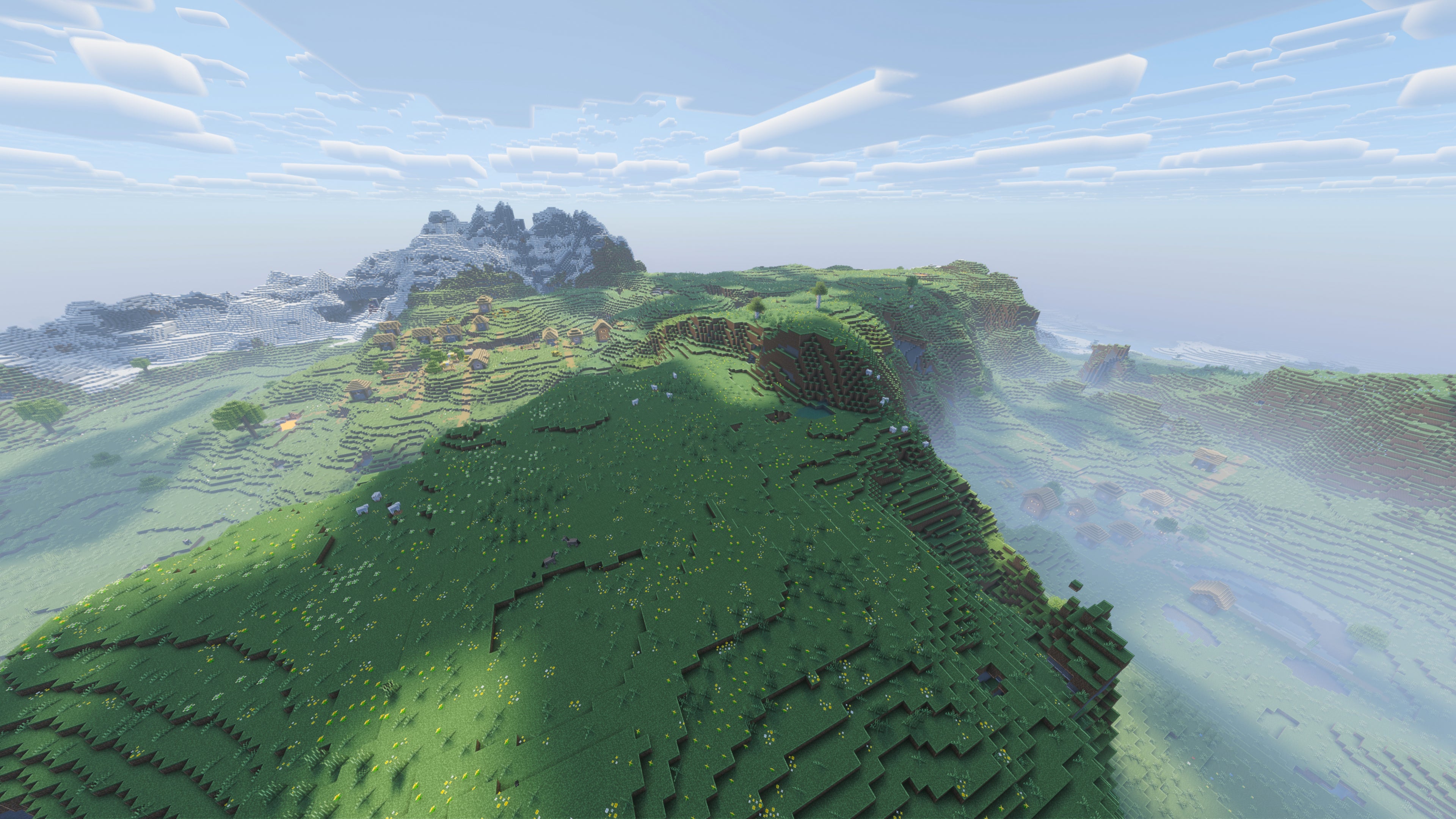 A landscape screenshot of a Minecraft seed, showing a large hilly plains biome with a river cutting through it, and a village on either side of the river. - 10