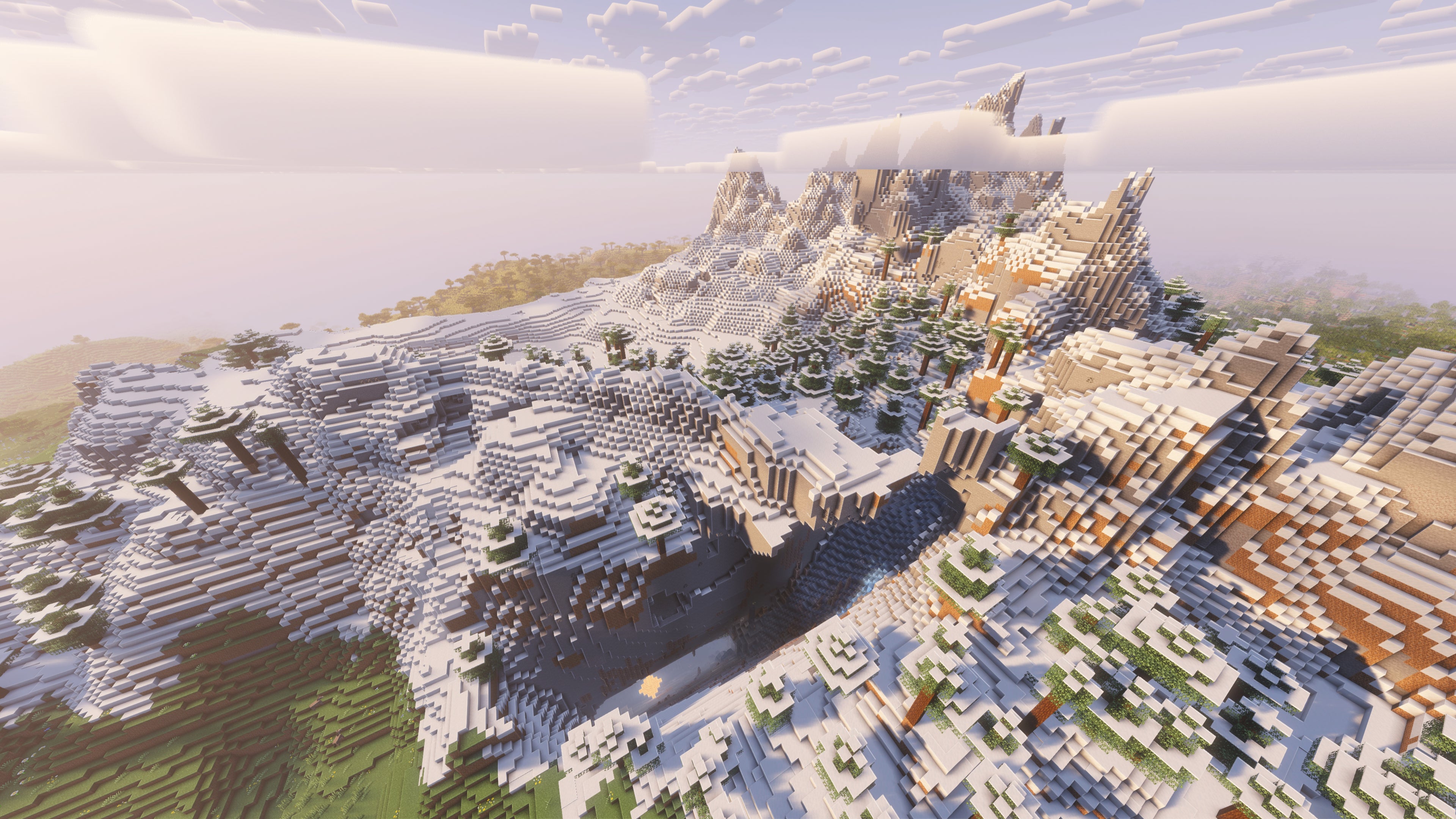 A landscape screenshot of a Minecraft seed, showing a spectacular snow-topped mountain range. - 31