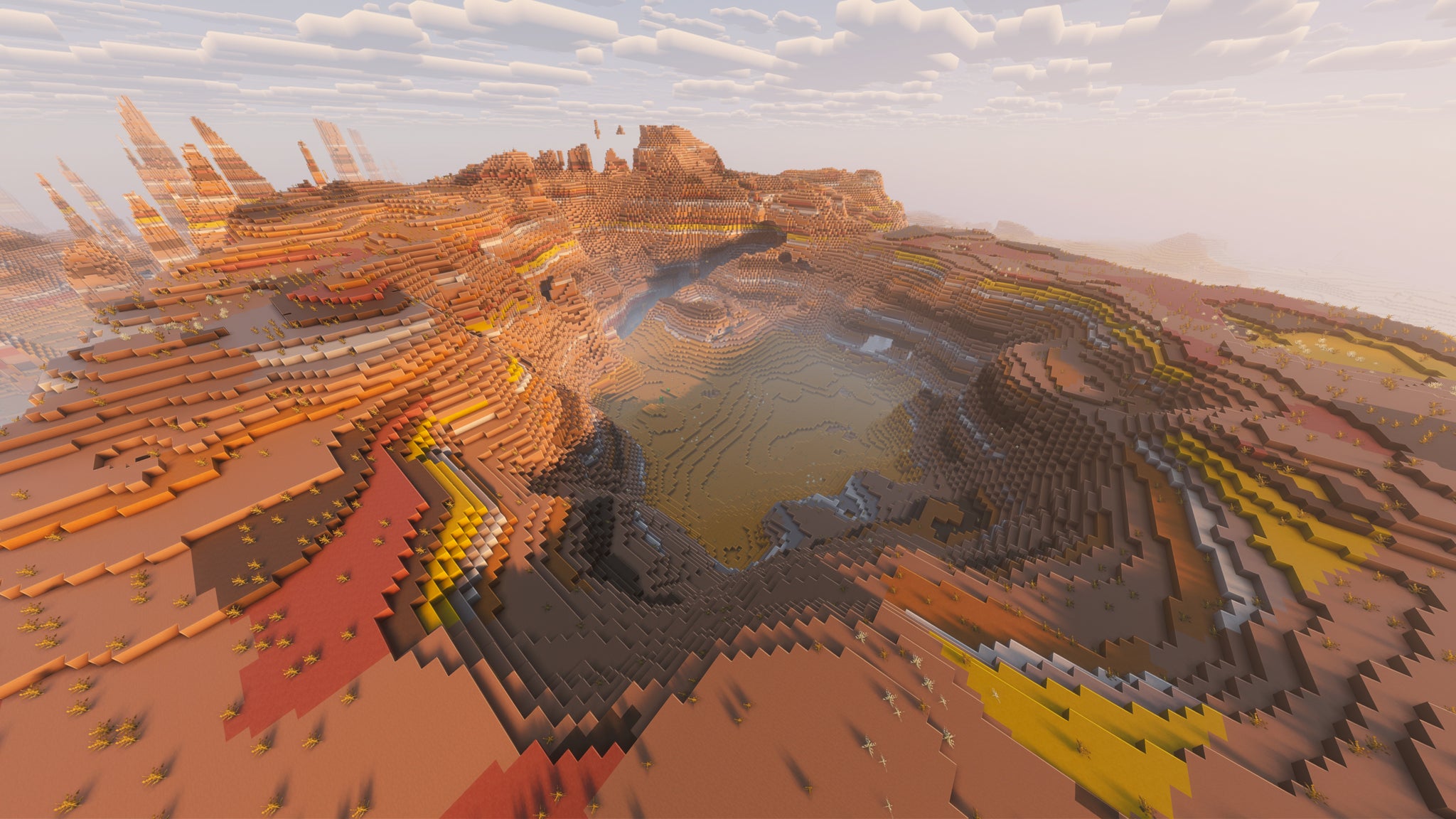 A landscape screenshot of a Minecraft seed, showing a massive crater in the middle of a Mesa biome. - 5