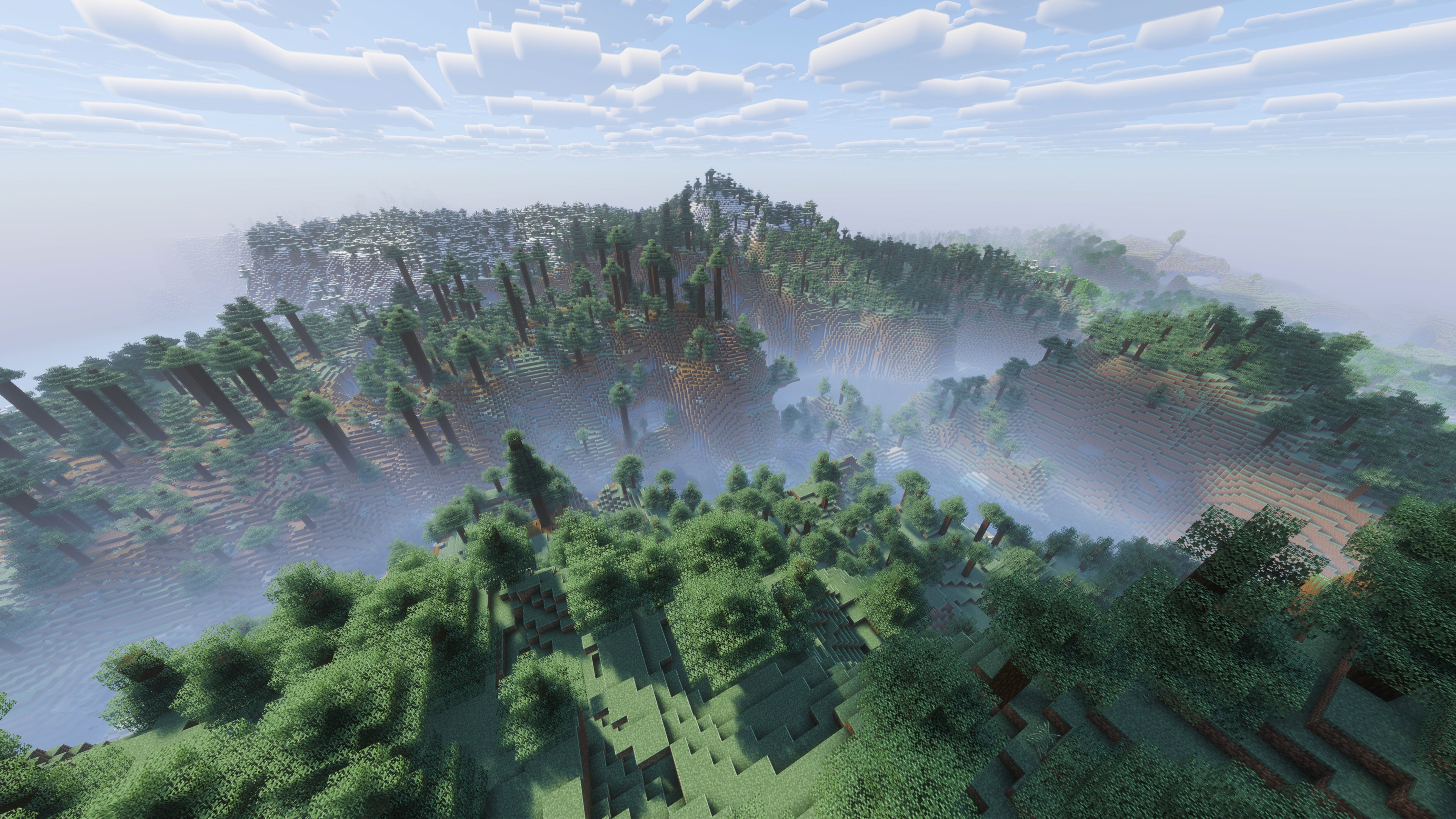 A landscape screenshot of a Minecraft seed, showing a sweeping vista of forest-topped hills. - 43
