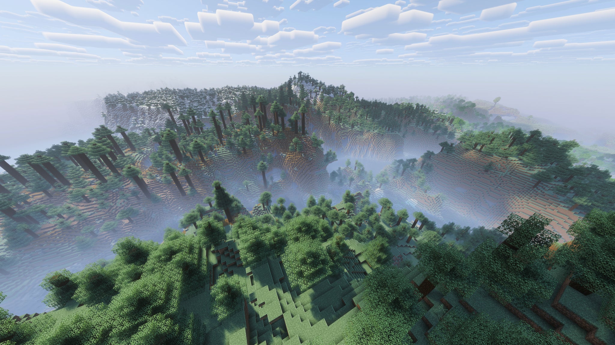 A landscape screenshot of a Minecraft seed, showing a sweeping vista of forest-topped hills. - 43