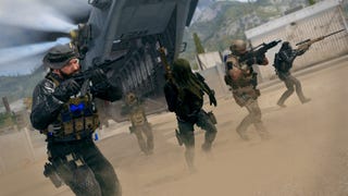 A squad of soldiers rush from a deployed helicopter, all with their rifles lifted, battle-ready. In Call of Duty Modern Warfare 3.