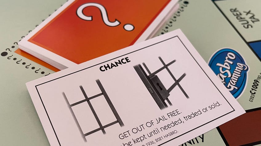 A Chance card which can be used to get out of jail free in Monopoly.
