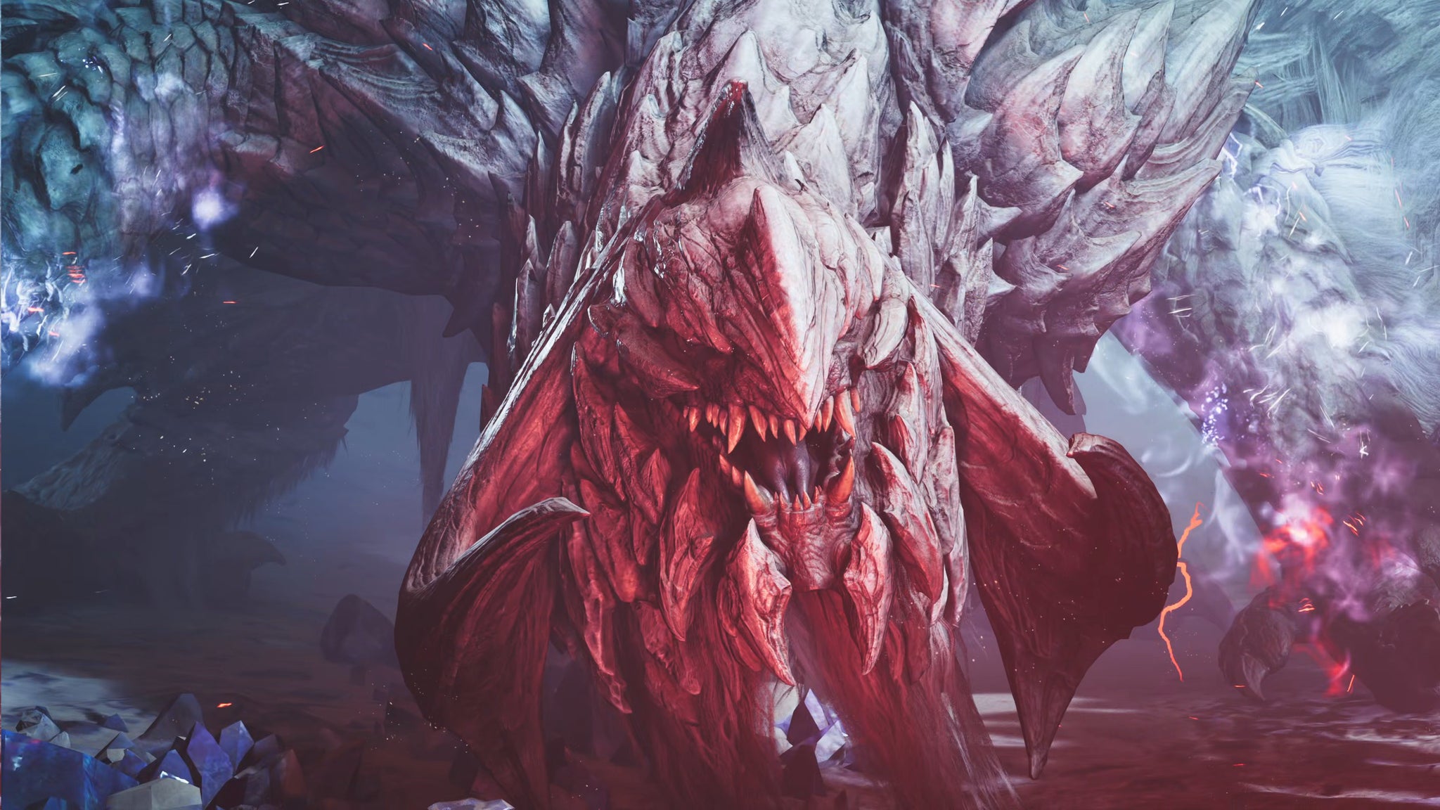 Arkveld, a large monster in Monster Hunter Wilds, bears down upon the camera with a red glow on its face. - 11