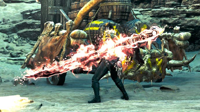 A hunter in Monster Hunter Wilds with their back to the camera charges up their Insect Glaive weapon until it’s burning red and white with energy.