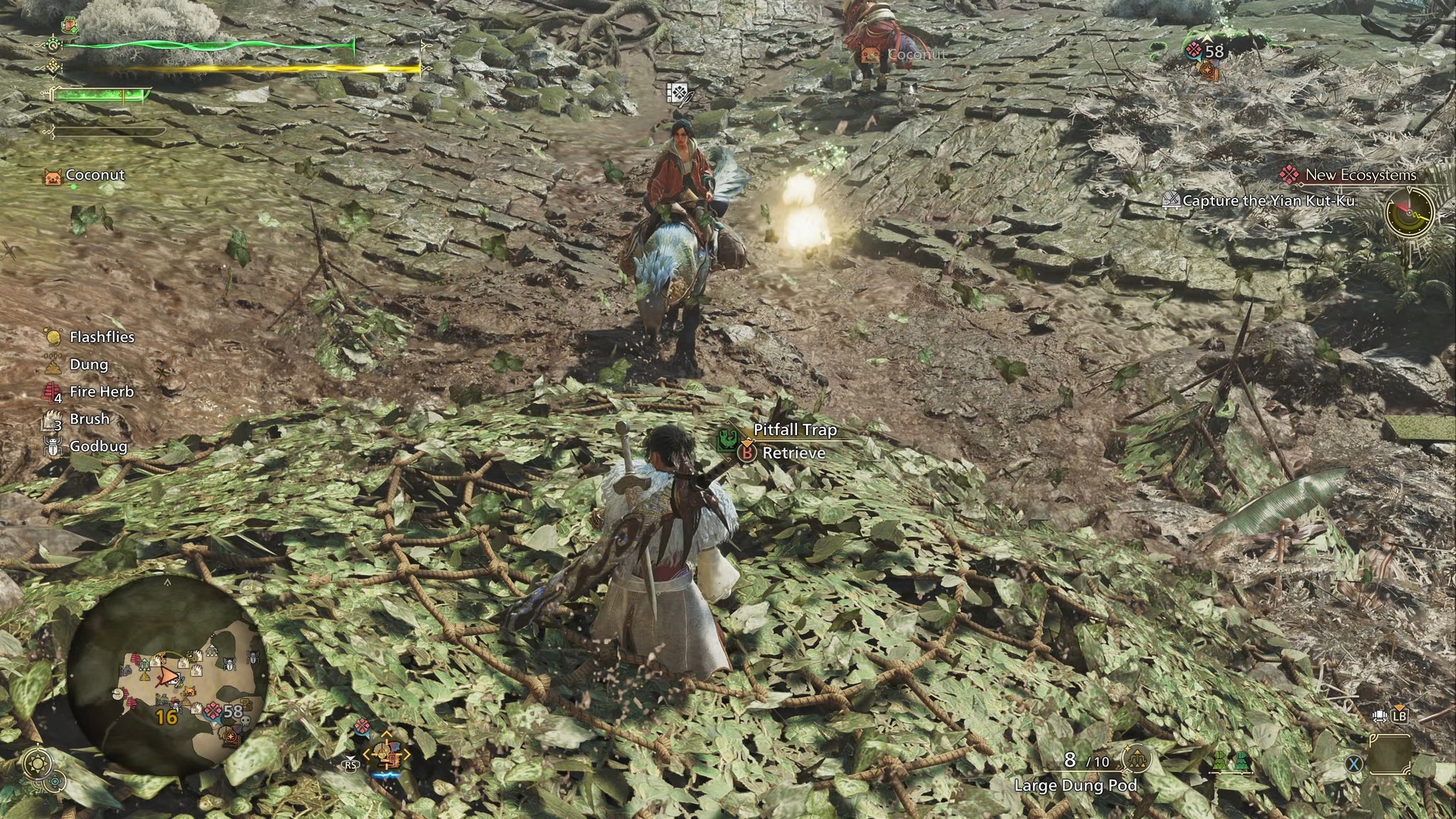 A hunter in Monster Hunter Wilds stands atop a Pitfall Trap after having just placed it on the ground in the Scarlet Forest. - 4