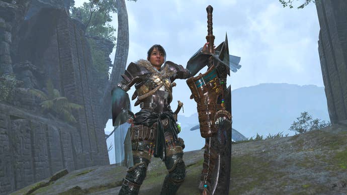 A female hunter in Monster Hunter Wilds poses in front of the camera with their weapon of choice, the Great Sword.