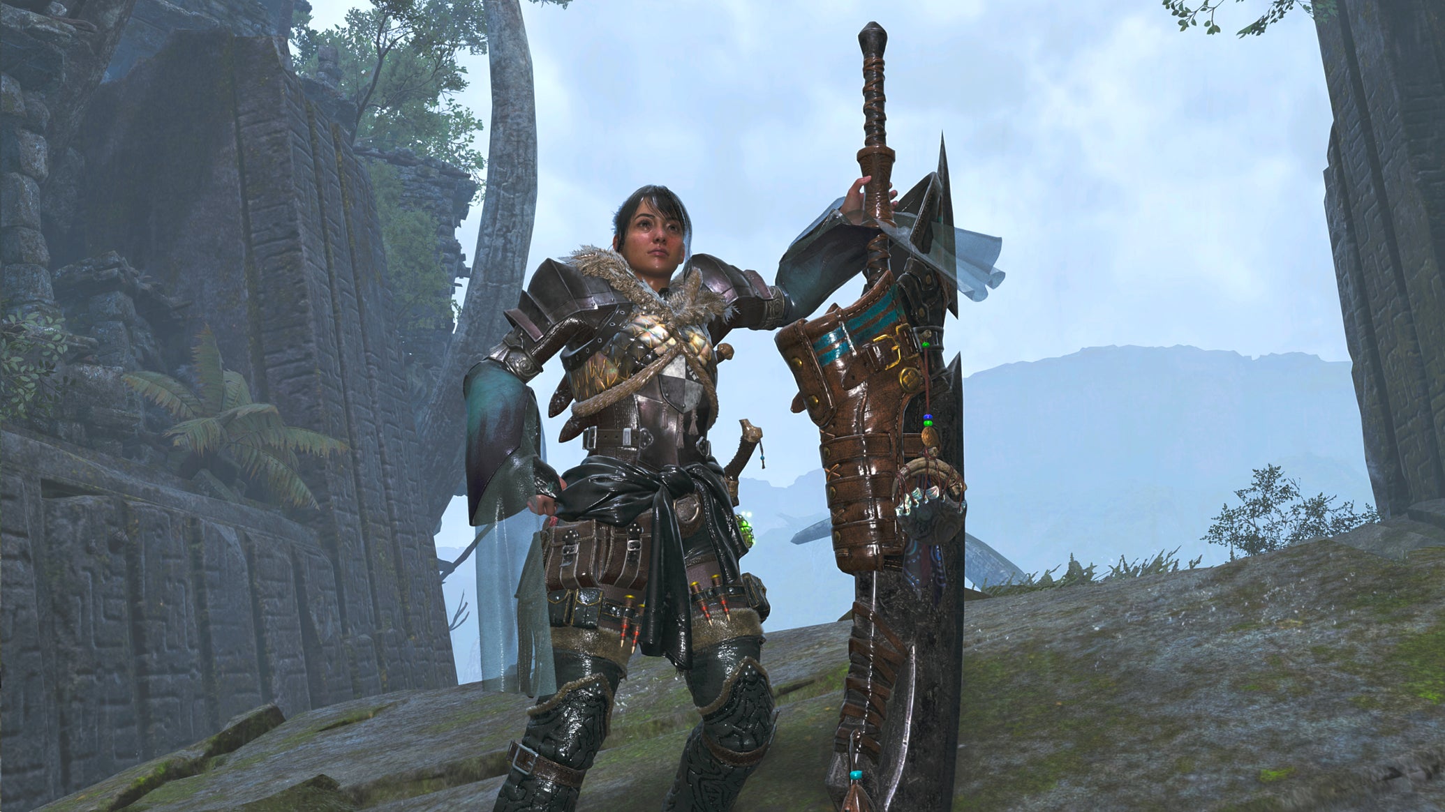 A female hunter in Monster Hunter Wilds poses in front of the camera with their weapon of choice, the Great Sword. - 1