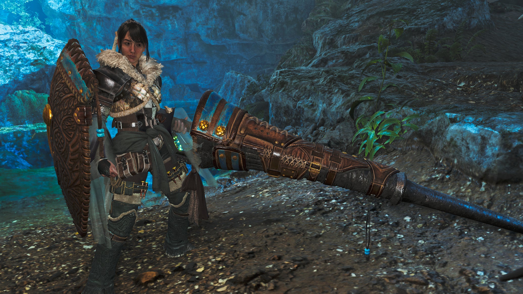 A female hunter in Monster Hunter Wilds poses in front of the camera with their weapon of choice, the Lance. - 1