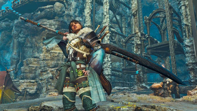 A female hunter in Monster Hunter Wilds poses in front of the camera with their weapon of choice, the Long Sword.