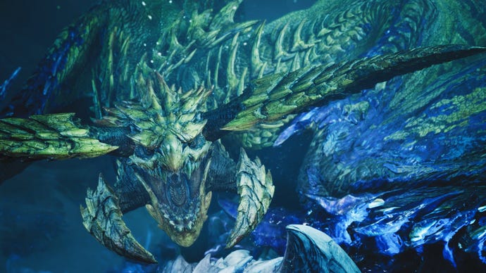 A glowing blue dragon with horned mandibles roars fiercely at the camera.