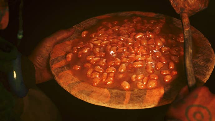 A plate of baked beans glistens.