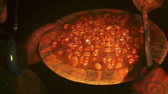 A plate of baked beans glistens.
