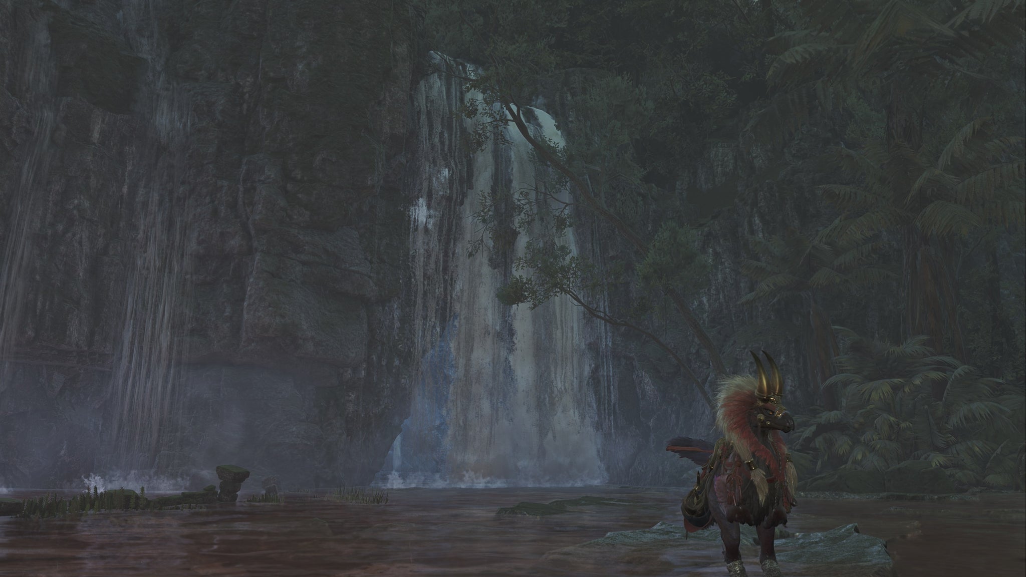 The player hunter in Monster Hunter Wilds looks towards a large waterfall in the Scarlet Forest, behind which lies the entrance to a hidden cave. - 5