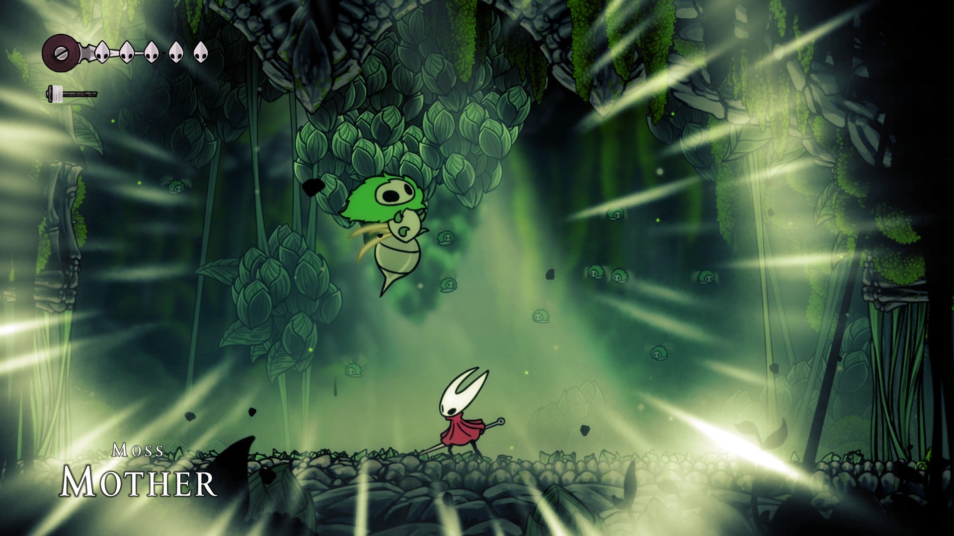 The boss Moss Mother, a green flying bug with a stinger on its tail, roars in Hollow Knight: Silksong. - 4