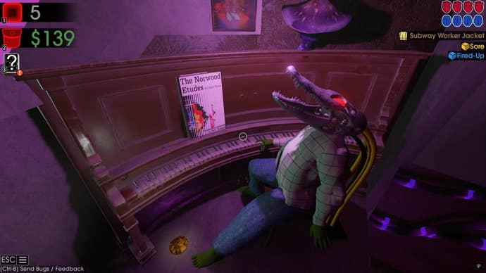 A puppet with a large, robotic crocodile head lies on a chair next to a curved piano in Moves of the Diamond Hand.
