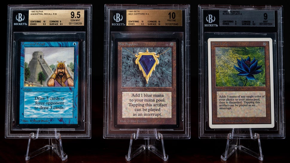 Magic: The Gathering cards Ancestral Recall, Mox Sapphire and Black Lotus in grading cases and display stands