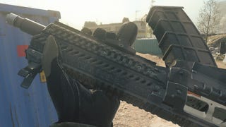 The player in Modern Warfare 3 inspects their Haymaker Shotgun.