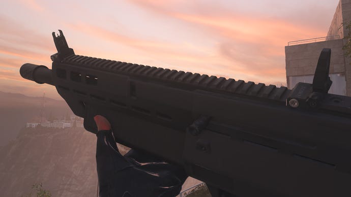 The player in Modern Warfare 2 inspects the MX Guardian Shotgun.