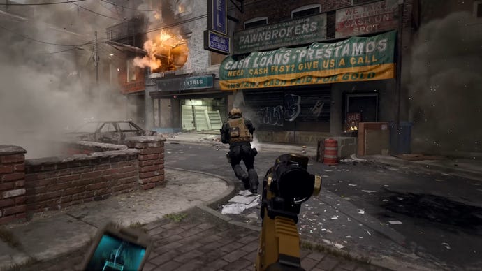 Two players in Modern Warfare 3 run together through a wartorn street.