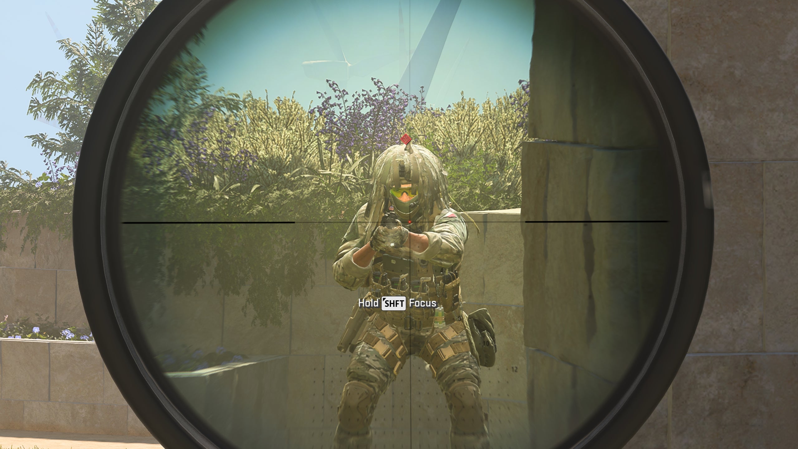 A player&rsquo;s sniper scope zooms in on an enemy soldier in Modern Warfare 3.